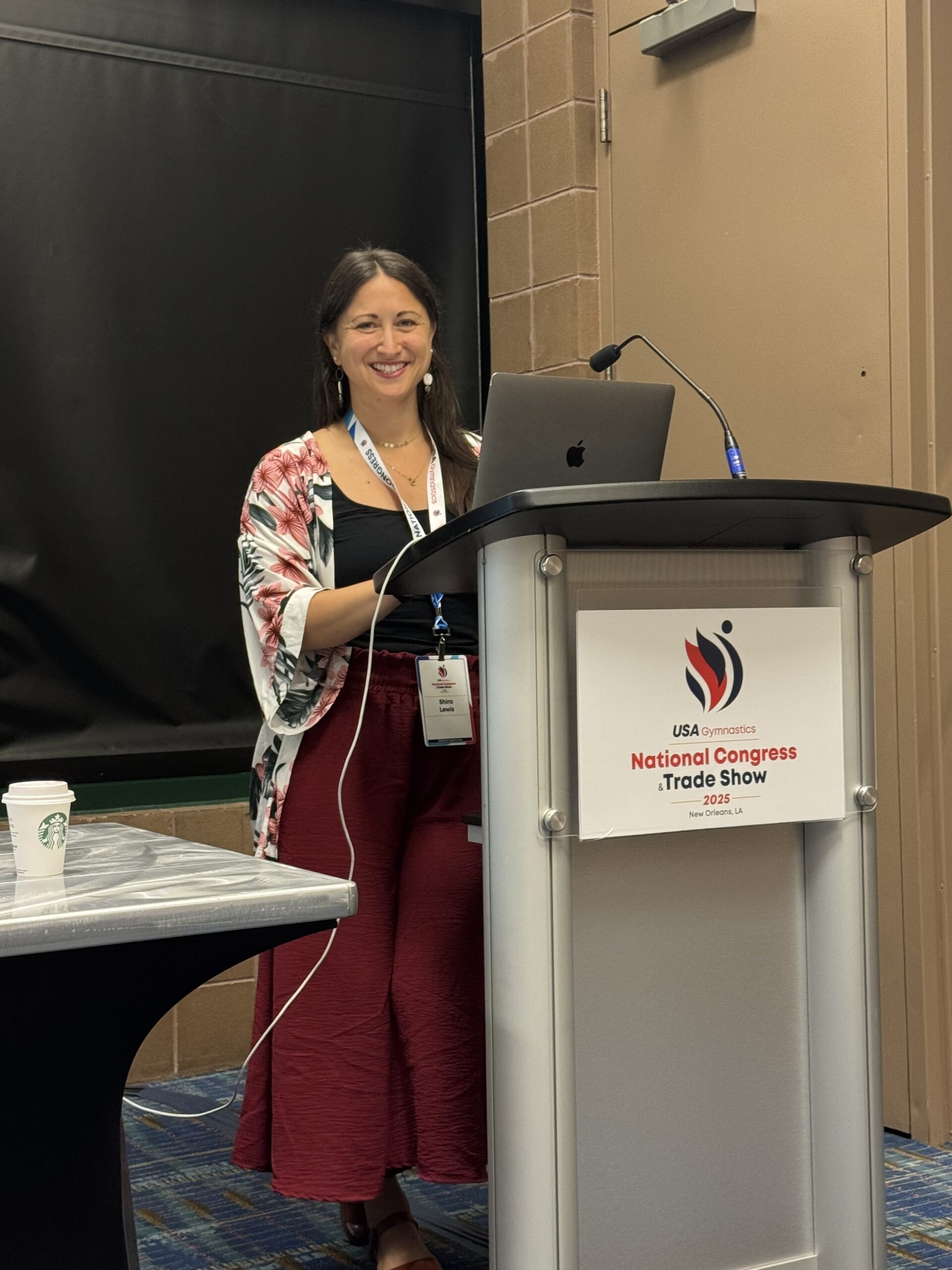 Dr. Shira presenting at a gymnastics congress